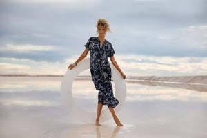 Model wearing Oneseason Charlbi Cotton Dress in Navy Algarve Print
