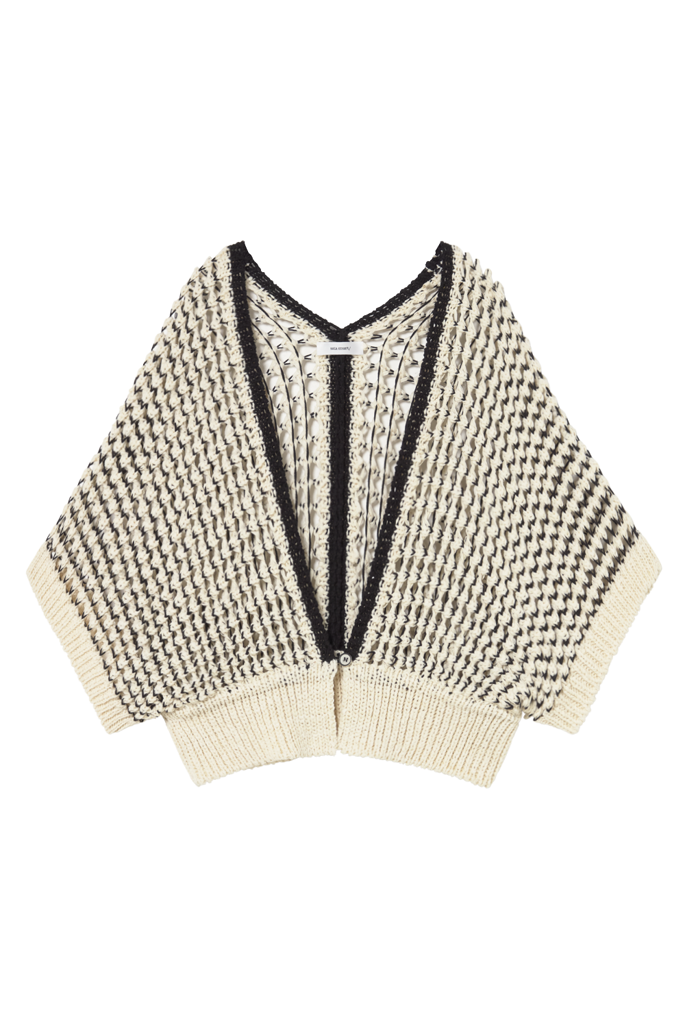 A cream and black knit poncho-style cardigan with a textured houndstooth-like pattern, ribbed trim, and a split V-neckline, shown flat on a white background.