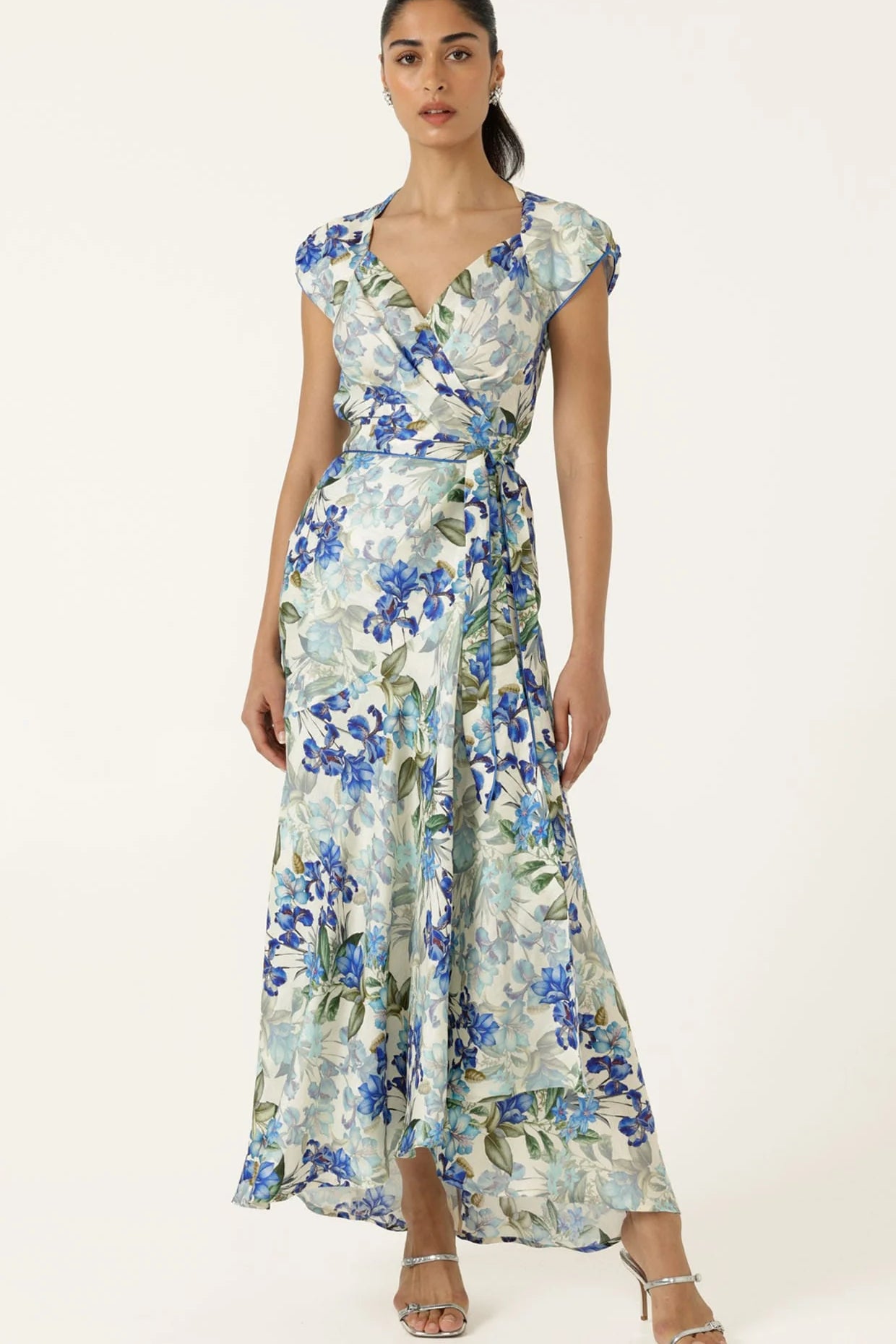 Woman wearing a floral dress on a white background