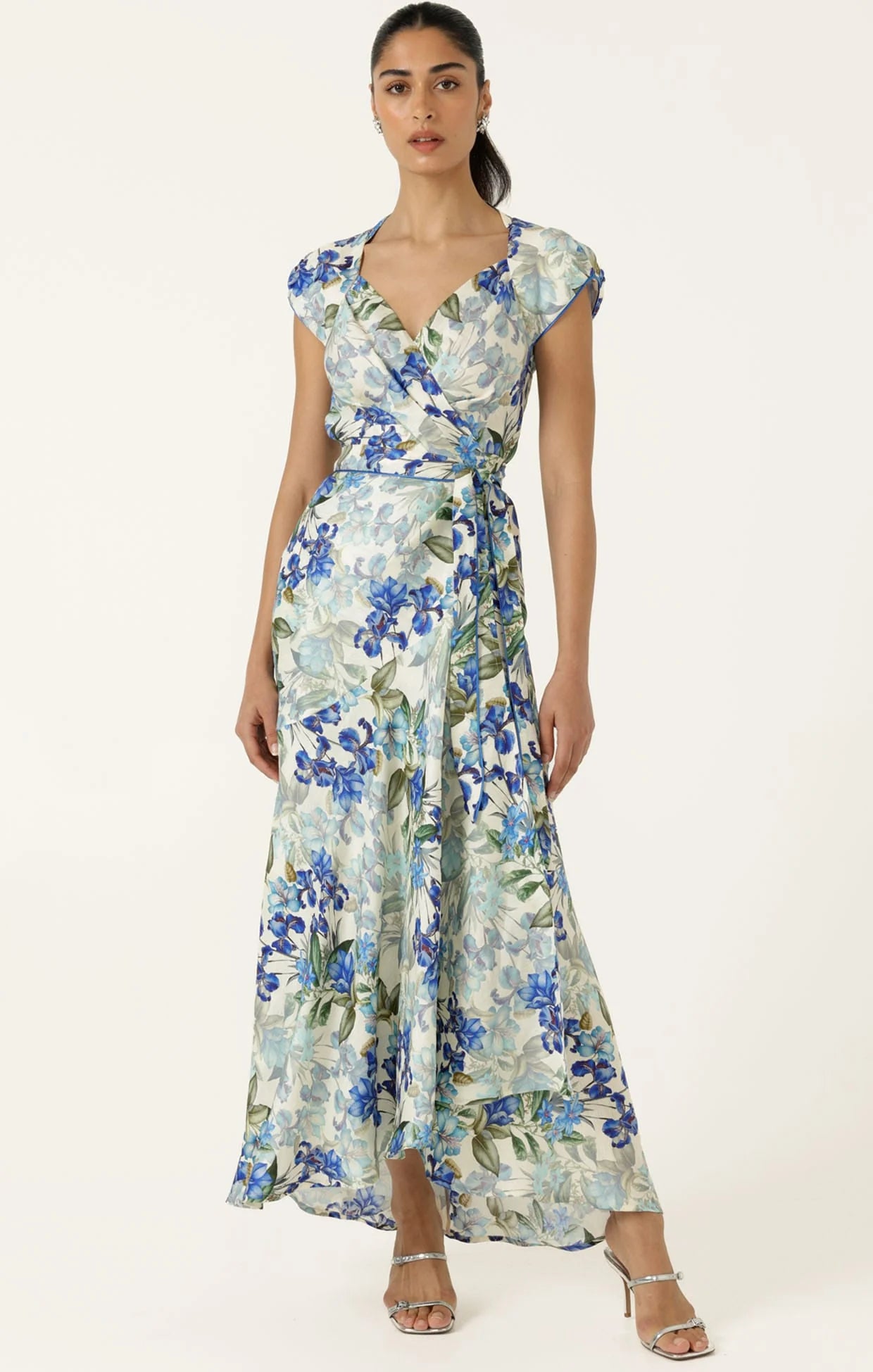 Woman wearing a floral dress on a white background