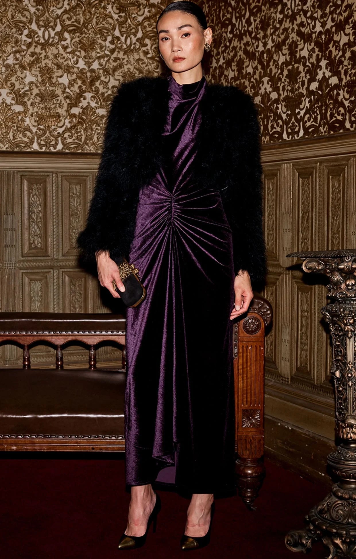 Woman wearing fur coat over Sacha Drake Lavish Velvet Cowl Dress in Amethyst