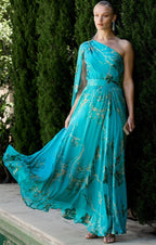 Model wearing Sacha Drake Lorelei Dress in jade green with long maxi skirt