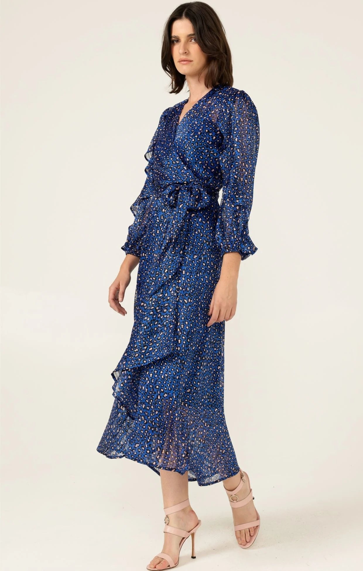 woman wearing Sacha Drake Shona Midi Wrap Dress with black and pink leopard print pattern