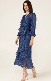 woman wearing Sacha Drake Shona Midi Wrap Dress with black and pink leopard print pattern