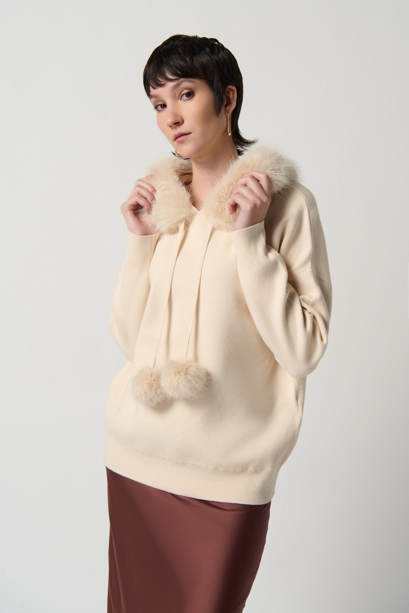 Shop Sweater With Faux Fur Hood & Pompoms Style 234921 │ Almond - Joseph Ribkoff